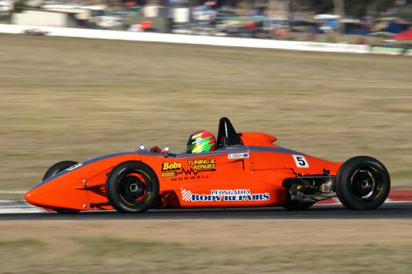 A Formula Ford race car carrying Bob's Tuning & Repairs signage on the track