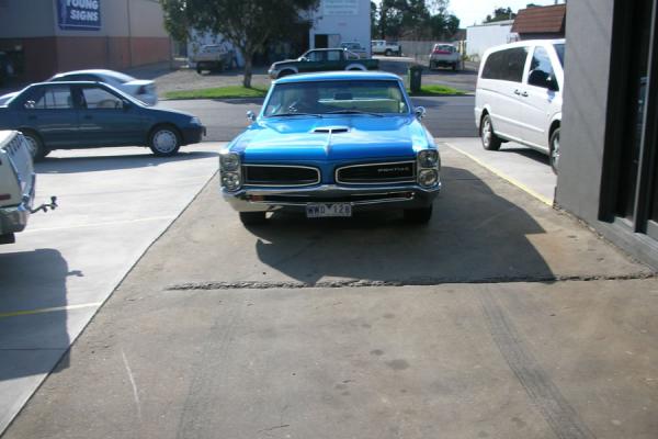 A classic Pontiac parked outside the Morwell workshop