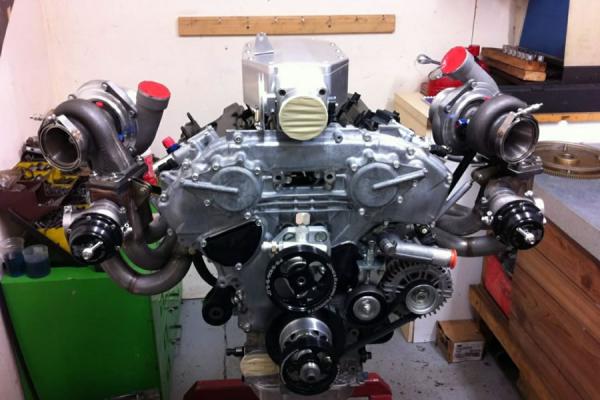 A twin-turbo V8 engine built up on the stand in the workshop