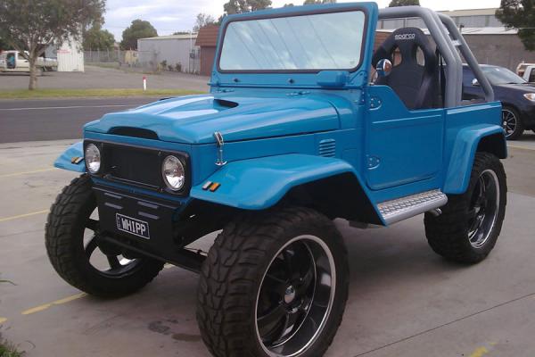 A restored Toyota Land Cruiser on custom wheels